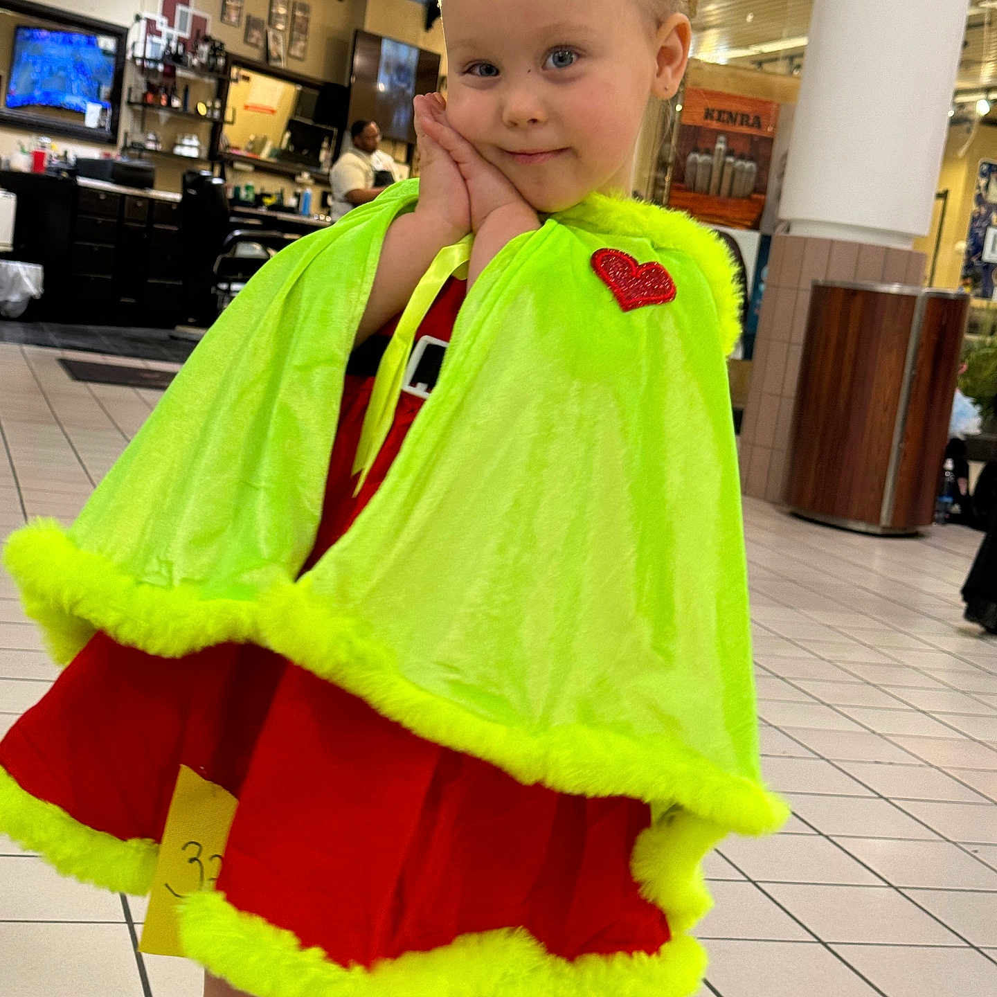 Scarlett is registered to the contest to win money with this photo: architecture, building, cape, child, clothing, computerhardware, costume, dress, electronics, face, female, hardware, head, monitor, outdoors, person, photography, portrait, screen, shelter