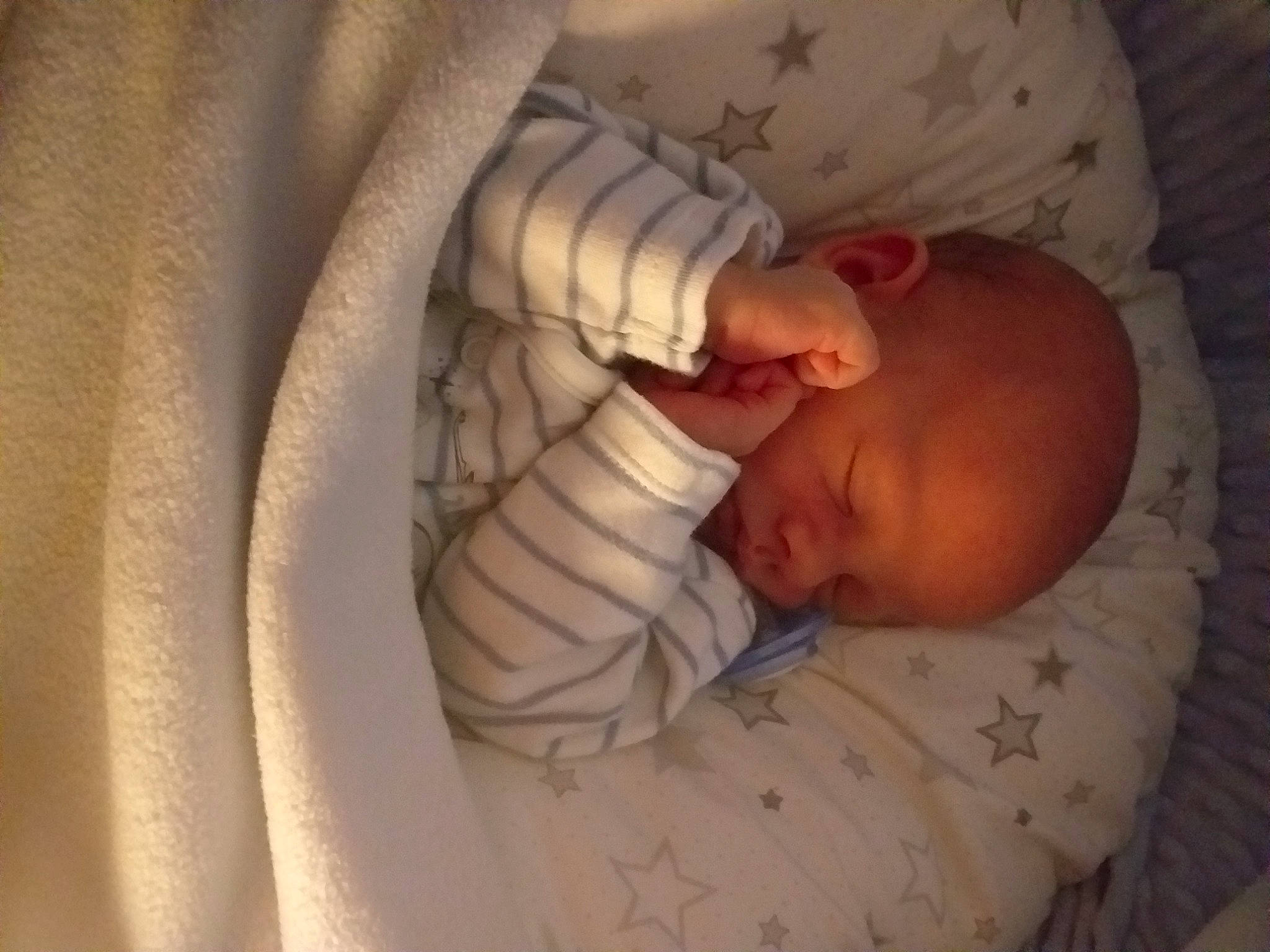 Ajay is registered to the contest to win money with this photo: baby, baby_sleeping, baby_toddler_clothing, bedtime, child, close_up, comfort, face, finger, hand, head, human_body, linens, mouth, nose, person, skin, sleeve, textile, toddler