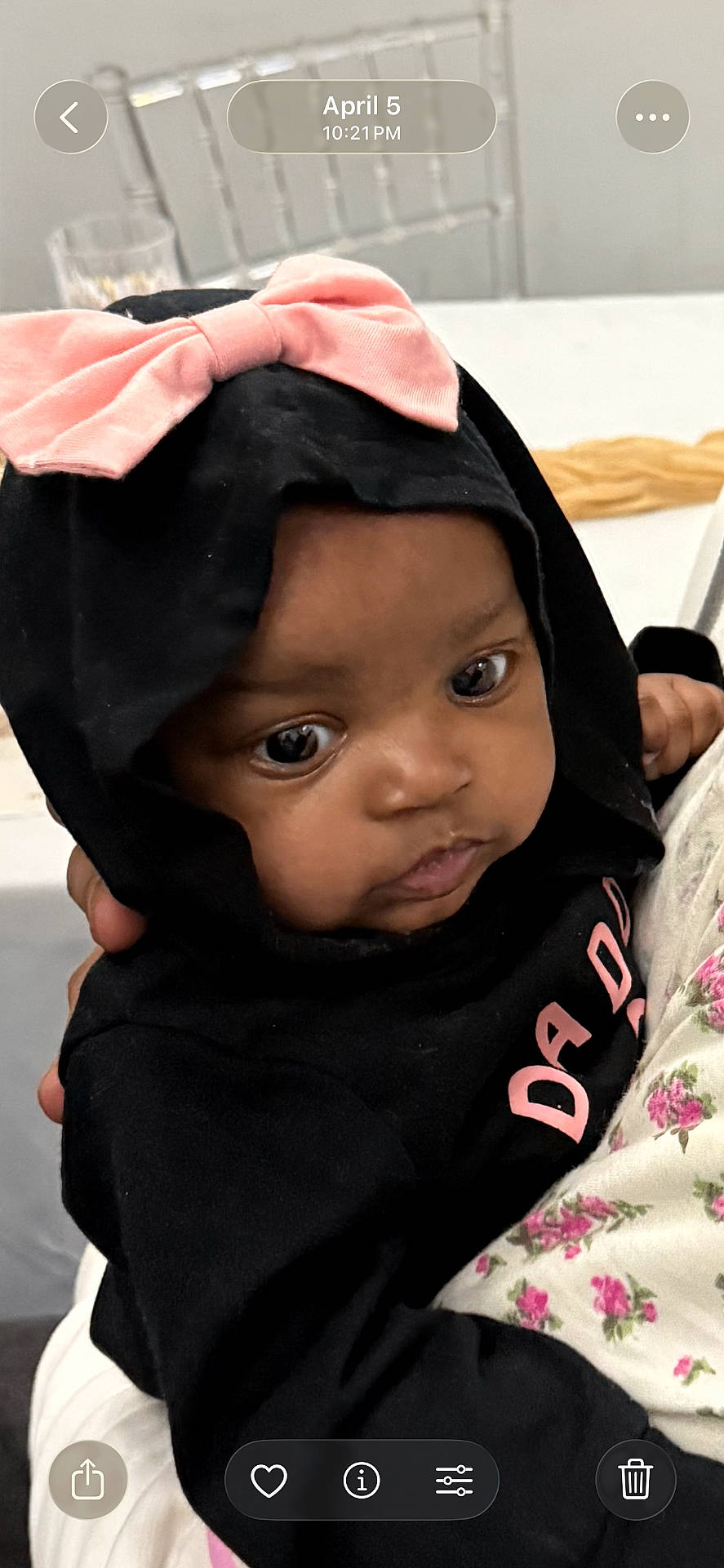 Samanii joined the competition — help win amazing prizes! baby, black_clothing, chair, child, closeup, clothing, cute, expression, face, floral_pattern, glass, hand, holding, hoodie, indoor, infant, person, pink_bow, portrait, table