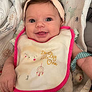 Anna participe au concours pour gagner de l'argent avec cette photo : baby, infant, smiling, headband, bib, toy, blanket, cute, happy, child, portrait, indoors, clothing, face, hands, expression, young, sitting, comfort, playtime