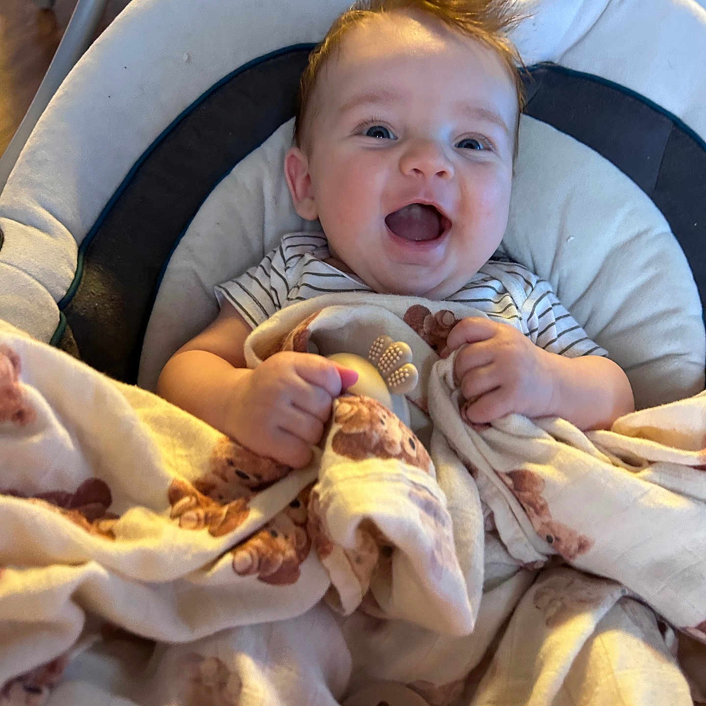 Sterling joined the competition — help win amazing prizes! baby, smiling, blanket, teddy_bear, pacifier, baby_seat, happy, child, infant, cute, indoor, person, clothing, face, hands, cozy, comfort, light, hair, playful