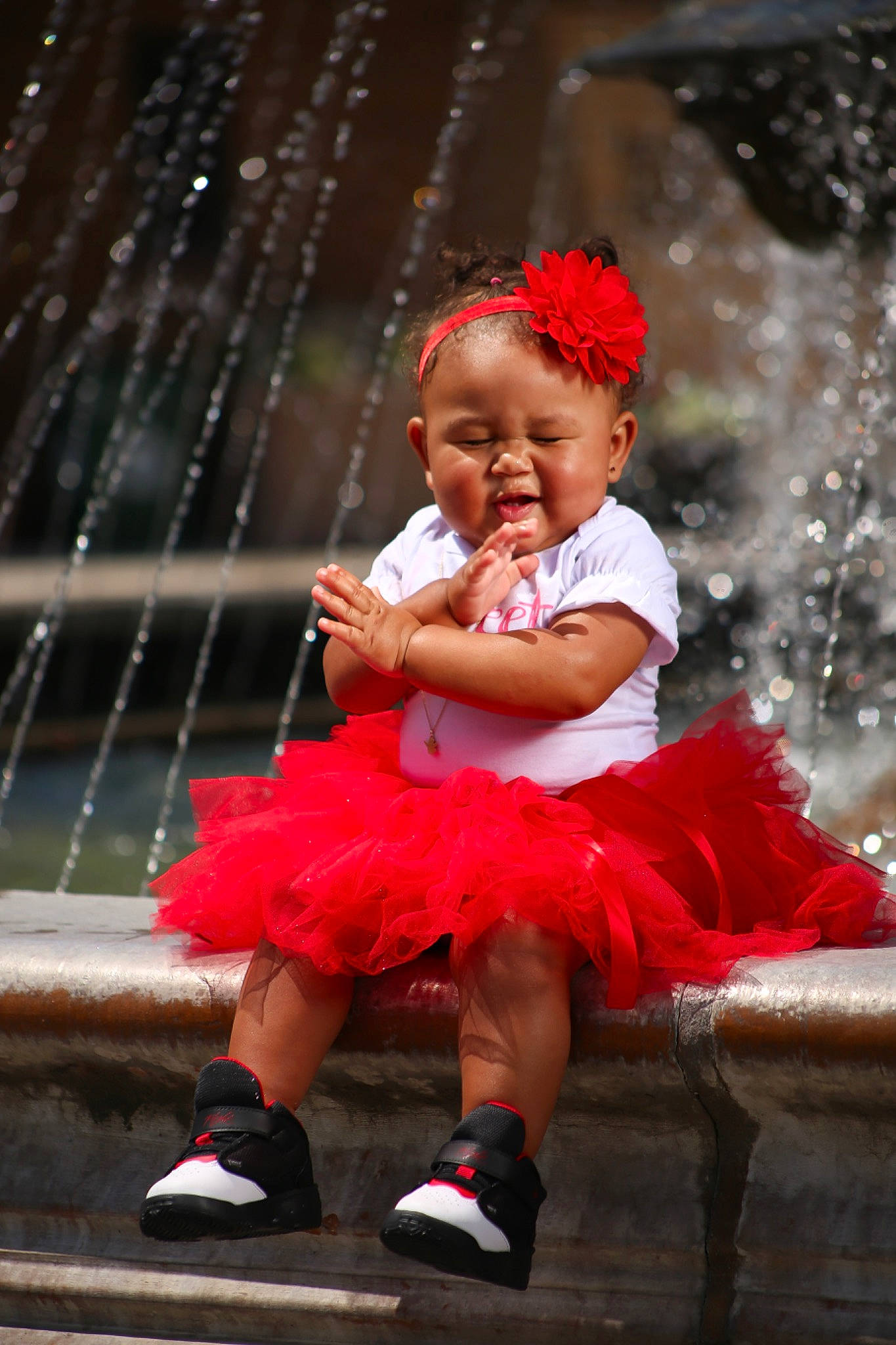 Azavia is registered to the contest to win money with this photo: baby, baby_toddler_clothing, child, dress, embellishment, event, fashion_accessory, flash_photography, flower, fun, happy, headpiece, magenta, person, pink, ruffle, shoe, sitting, smile, standing