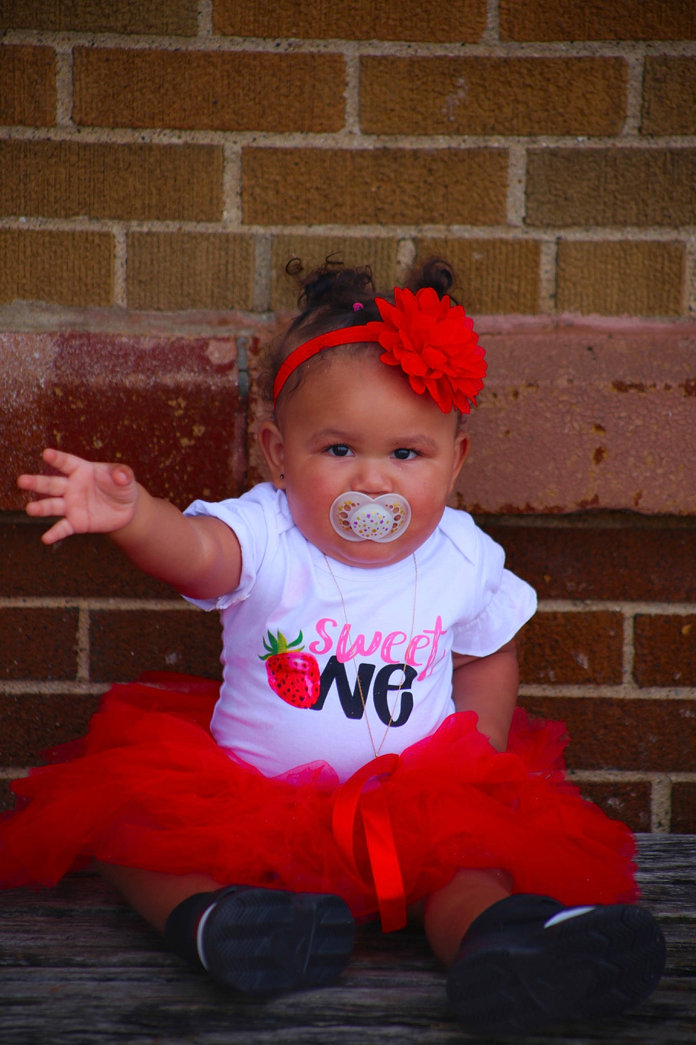 Azavia joined the competition — help win amazing prizes! baby, baby_toddler_clothing, brick, child, costume, costume_hat, event, fashion_accessory, fun, happy, hat, head, headband, headwear, magenta, person, pink, red, sitting, sleeve