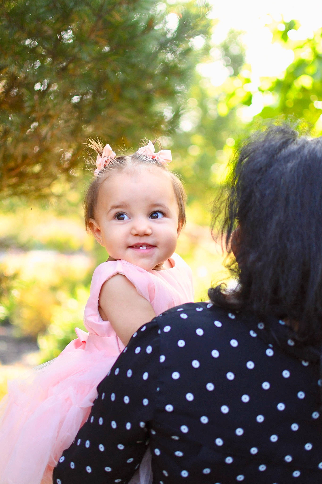 Alivia is registered to the contest to win money with this photo: baby, baby_toddler_clothing, ceremony, child, day_dress, event, flash_photography, formal_wear, fun, gesture, grass, happy, joy, one_piece_garment, pattern, people_in_nature, person, plant, portrait_photography, smile