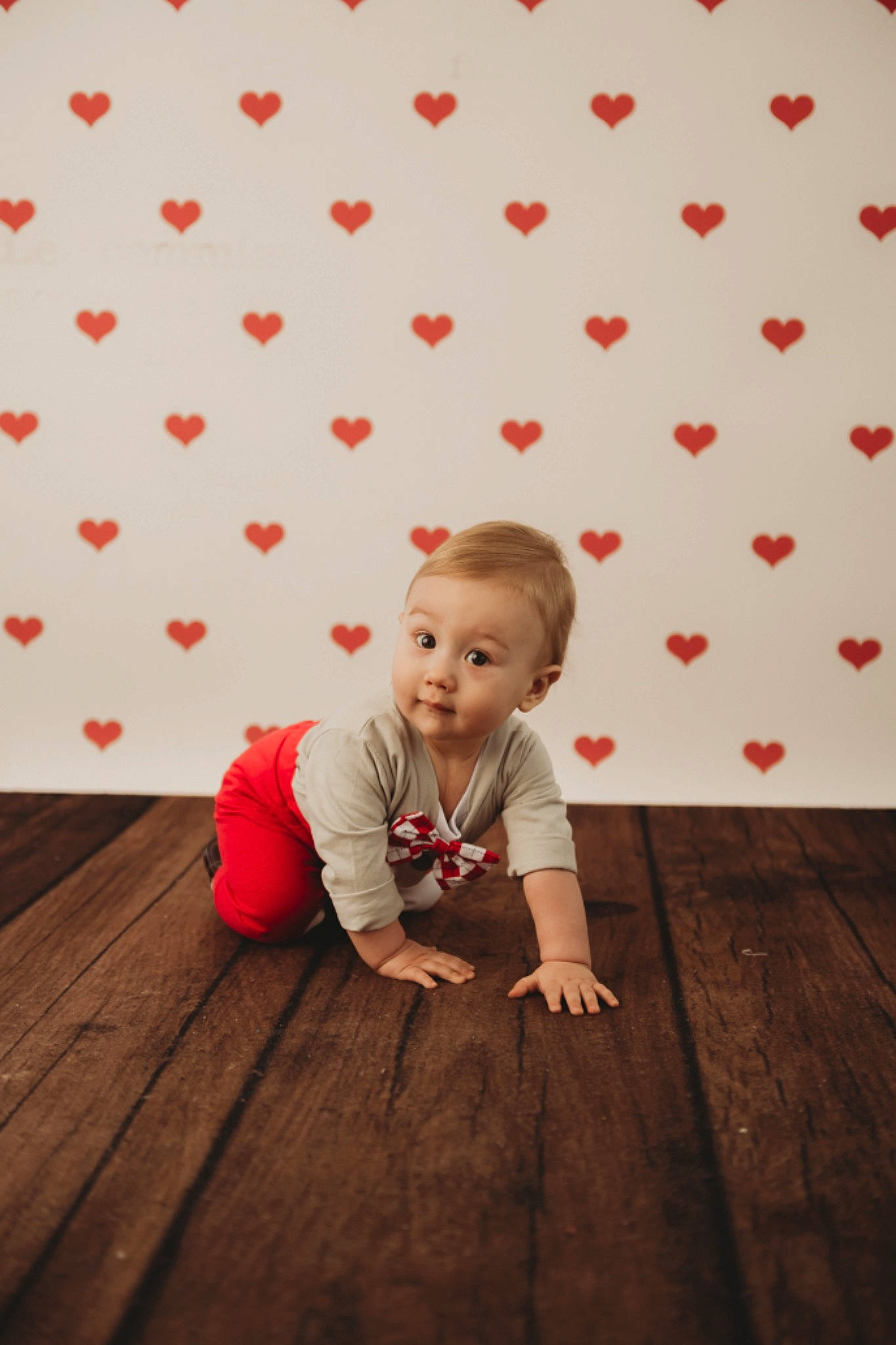 Bruce is registered to the contest to win money with this photo: baby, baby_toddler_clothing, brown, cheek, child, flash_photography, floor, flooring, grass, happy, hardwood, leaf, orange, people_in_nature, person, pink, red, skin, standing, toddler