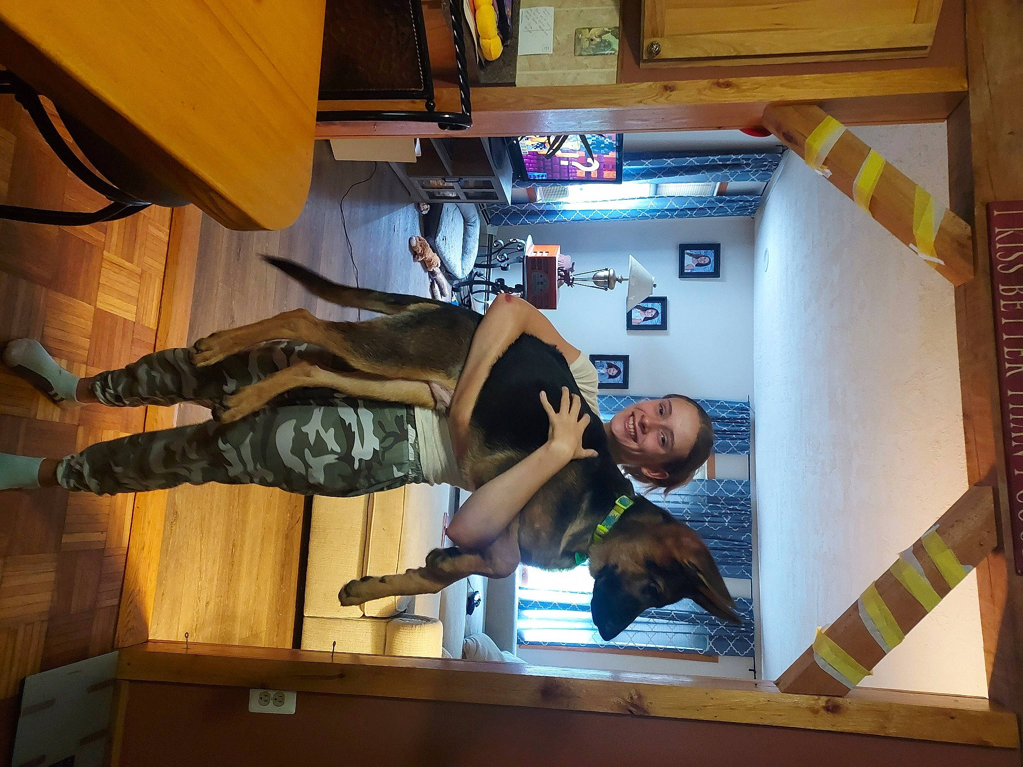 Valentina is registered to the contest to win money with this photo: building, display_device, flooring, fun, hardwood, human_leg, joy, machine, person, room, thigh, wood