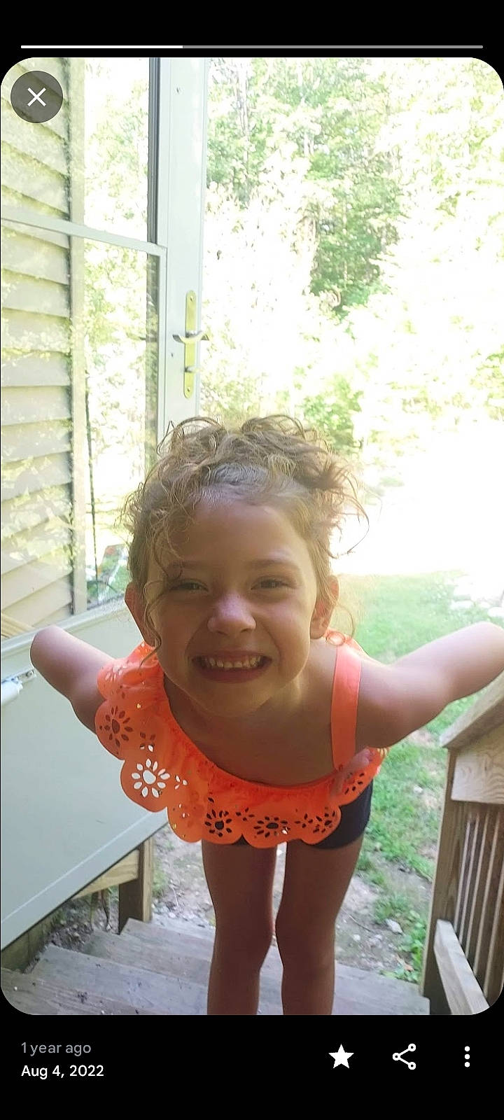 Angelina is registered to the contest to win money with this photo: baby_toddler_clothing, child, facial_expression, finger, fun, gesture, grass, hairstyle, happy, joy, laugh, leisure, lip, person, recreation, shoulder, skin, smile, standing, swimwear