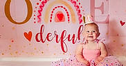 Lainey joined the competition — help win amazing prizes! baby, background, birthday, celebration, child, confetti, crown, cute, decor, festive, girl, happy, heart, one_year, party, pink, portrait, sitting, smiling, tutu