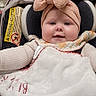 Lainey joined the competition — help win amazing prizes! baby, blanket, car_seat, chair, child, clothing, cozy, cute, face, floor, happy, headband, indoor, infant, person, pink, portrait, smiling, toddler, young_child