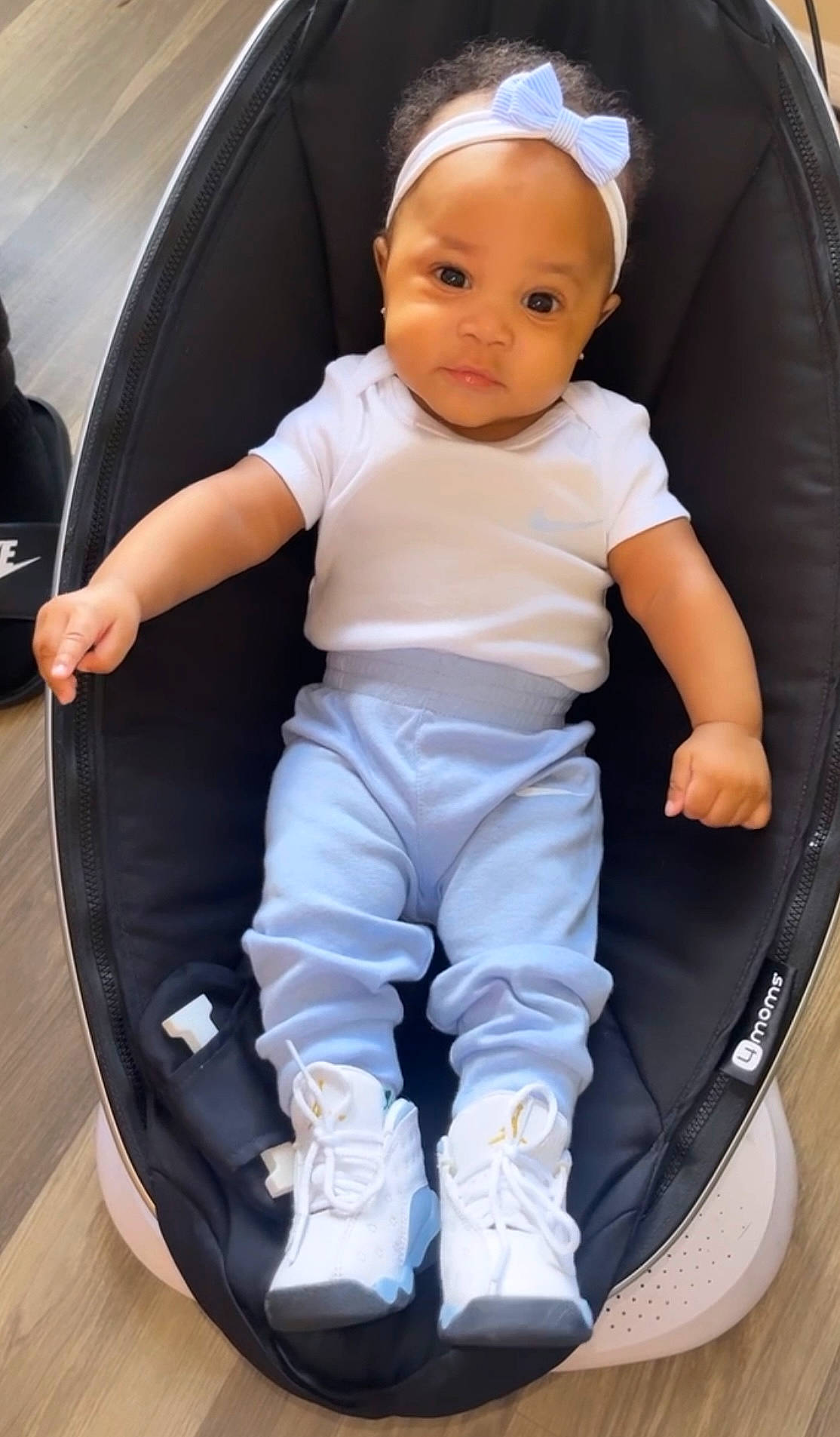 Demi is registered to the contest to win money with this photo: auto_part, baby, baby_carriage, baby_products, baby_toddler_clothing, car_seat, child, comfort, electric_blue, fashion_accessory, flash_photography, fun, gesture, happy, knee, person, recreation, sitting, sneakers, toddler