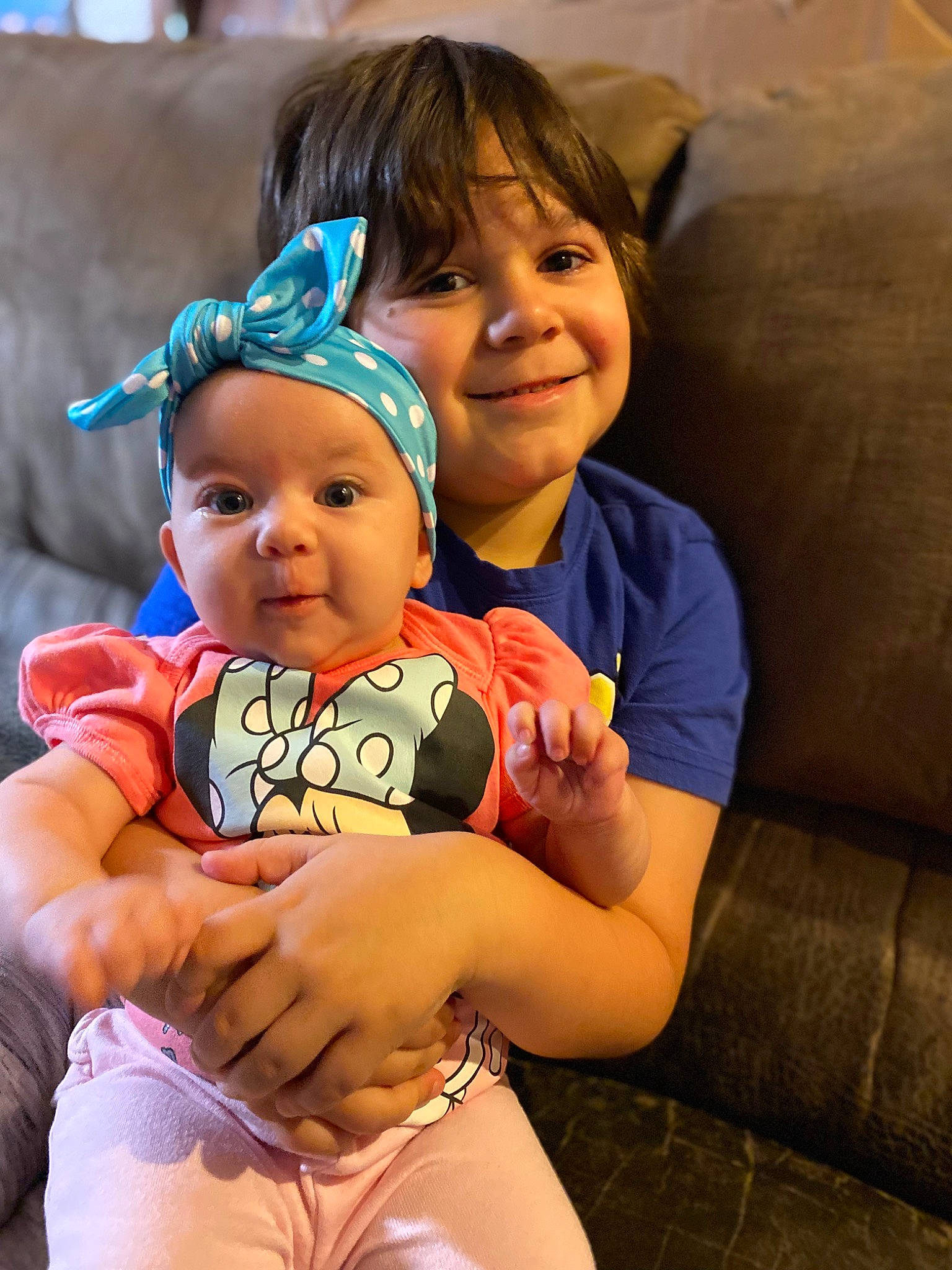 Leilani is registered to the contest to win money with this photo: baby_toddler_clothing, comfort, cool, eye, face, finger, gesture, happy, hat, head, headwear, human_body, interaction, iris, joy, leisure, mouth, person, skin, smile