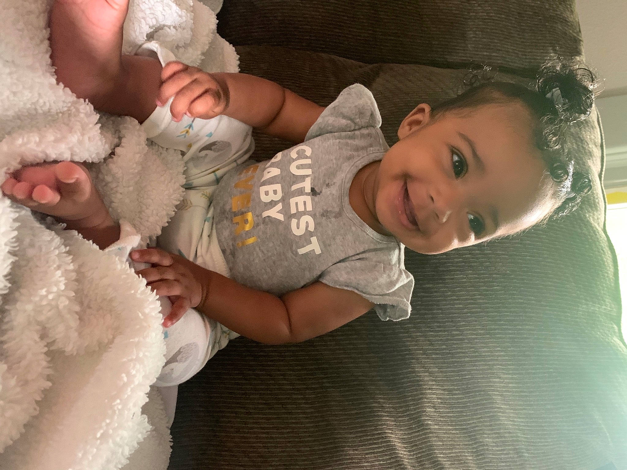 Harlee is registered to the contest to win money with this photo: baby, baby_toddler_clothing, child, comfort, finger, flash_photography, gesture, hand, happy, hat, headgear, human_body, iris, joy, lip, mouth, nose, person, skin, sleeve