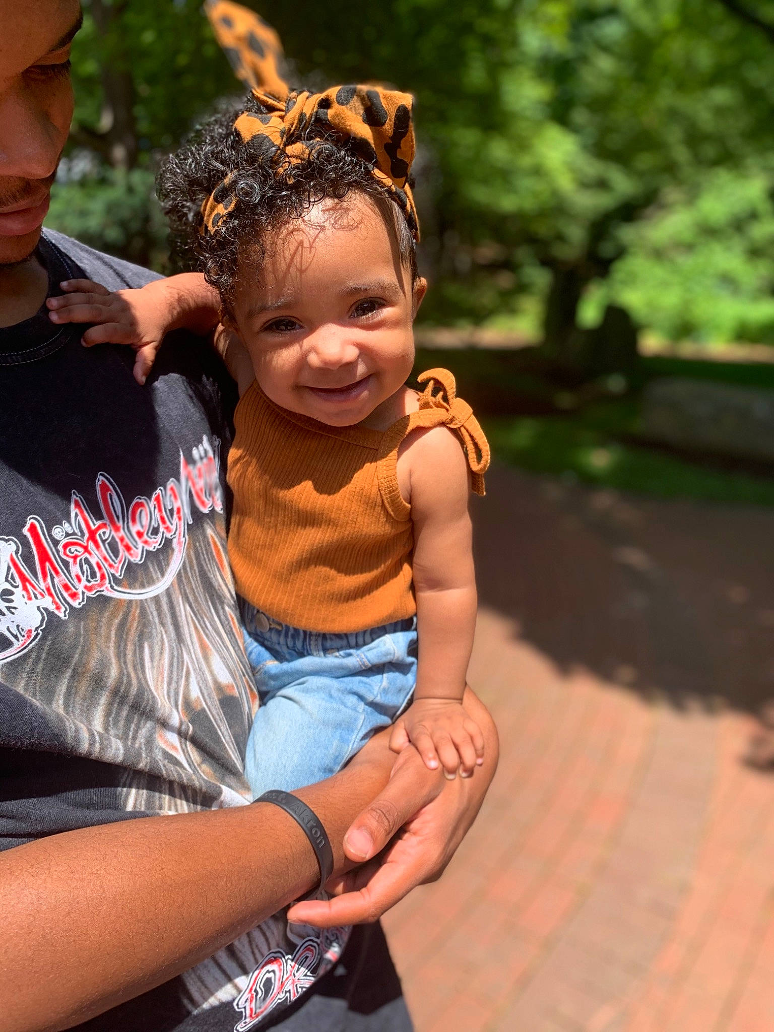 Harlee is registered to the contest to win money with this photo: abdomen, bracelet, child, event, fashion_accessory, fun, gesture, grass, happy, headpiece, jewellery, joy, leisure, necklace, person, recreation, sitting, smile, summer, toddler