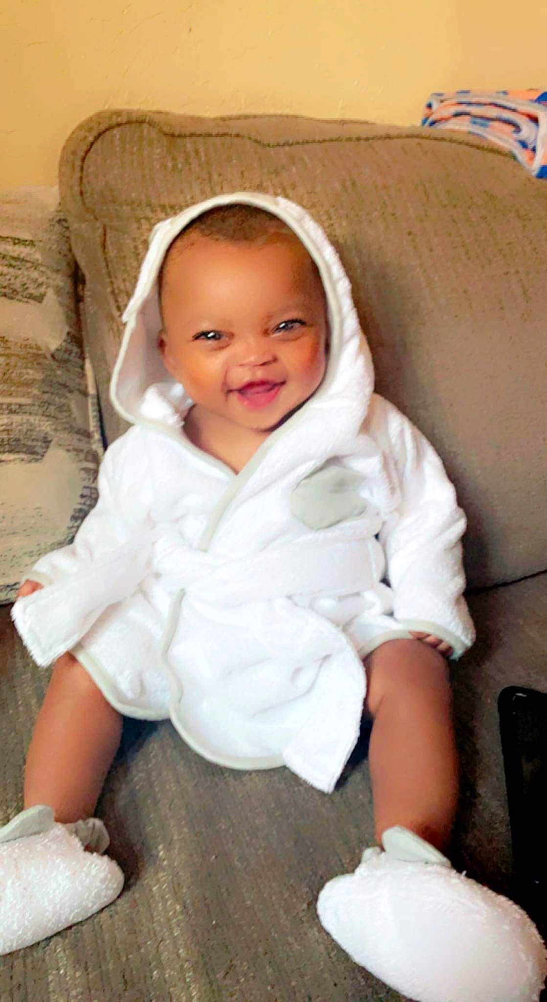 A'Myll is registered to the contest to win money with this photo: baby, baby_toddler_clothing, cheek, child, chin, comfort, fur, happy, iris, jacket, joy, linens, lip, nose, person, sitting, skin, sleeve, smile, toddler