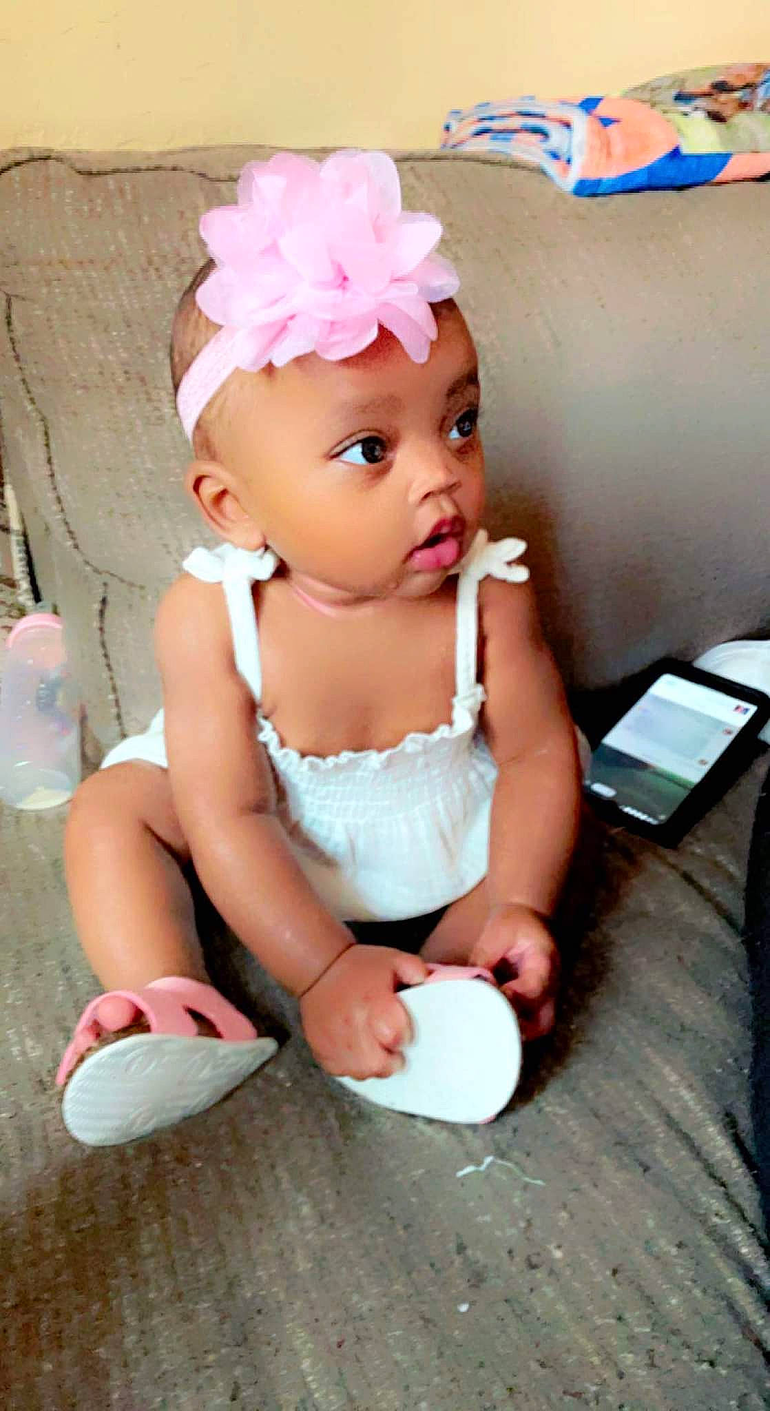 A'Myll is registered to the contest to win money with this photo: baby, baby_toddler_clothing, child, dress, eyelash, face, flash_photography, fun, happy, hat, head, headband, headgear, headpiece, headwear, leg, person, petal, pink, skin