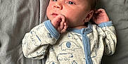 Dawson joined the competition — help win amazing prizes! baby, bodypart, clothing, coat, couch, face, finger, furniture, hand, head, knitwear, longsleeve, newborn, pajamas, pants, person, photography, portrait, sleeve, sweater