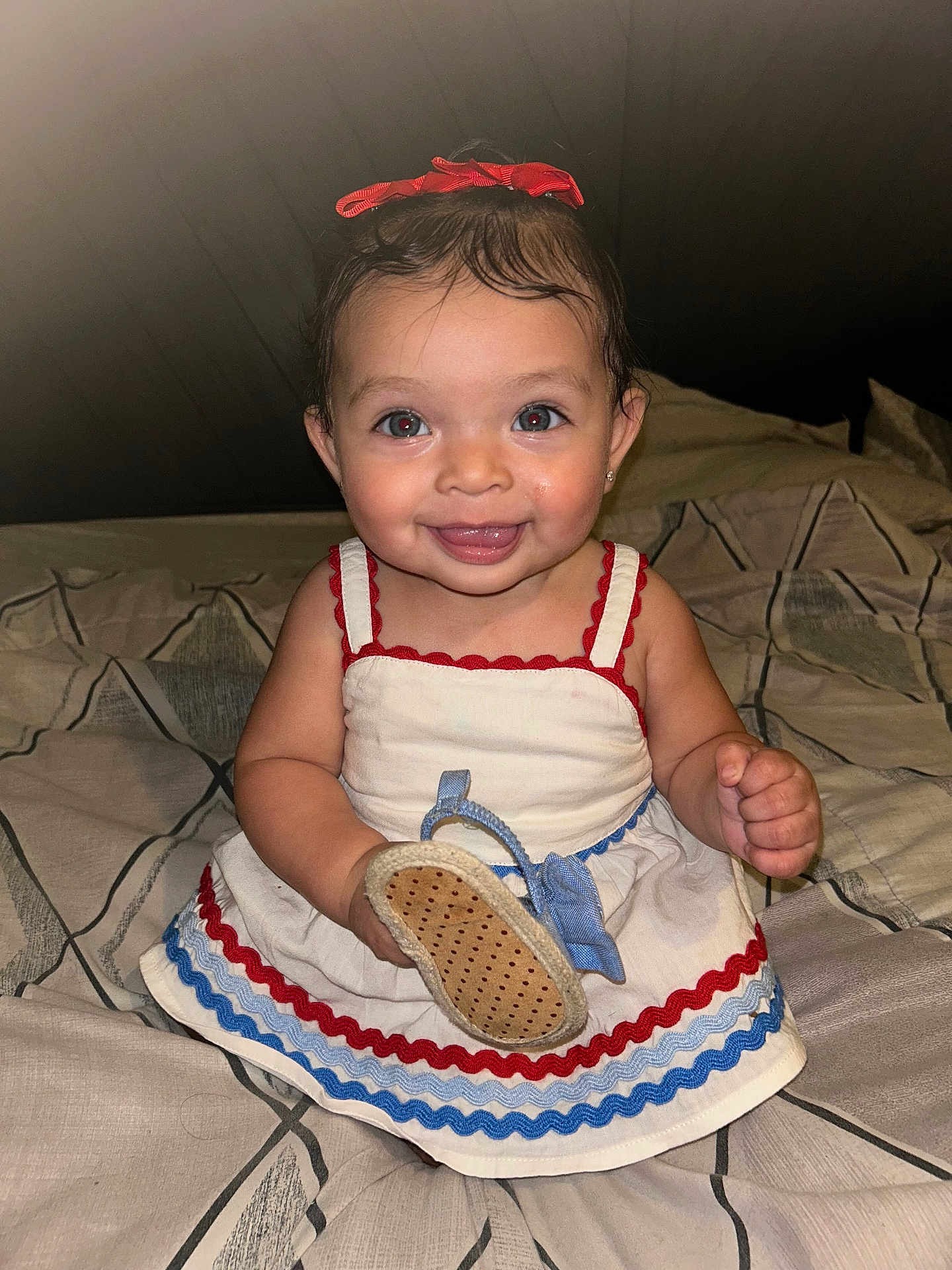 Gianna joined the competition — help win amazing prizes! baby, child, smiling, dress, bow, bed, indoor, happy, holding, footwear, cute, person, portrait, young, fashion, accessory, sitting, infant, clothing, pattern