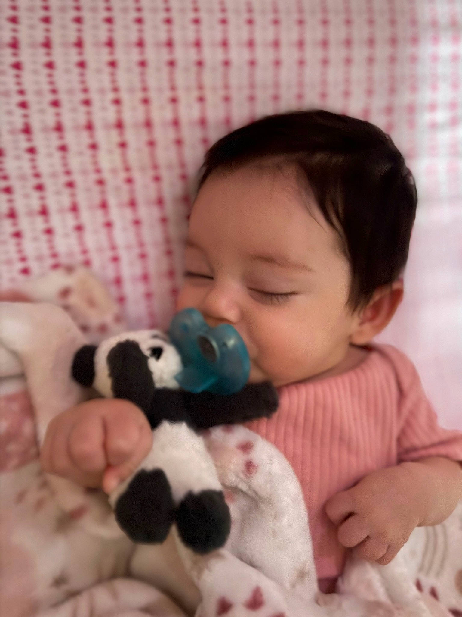 Khloee is registered to the contest to win money with this photo: baby, baby_sleeping, baby_toddler_clothing, cheek, child, comfort, face, finger, happy, head, linens, mammal, nose, person, pink, skin, stuffed_toy, textile, toddler, toy