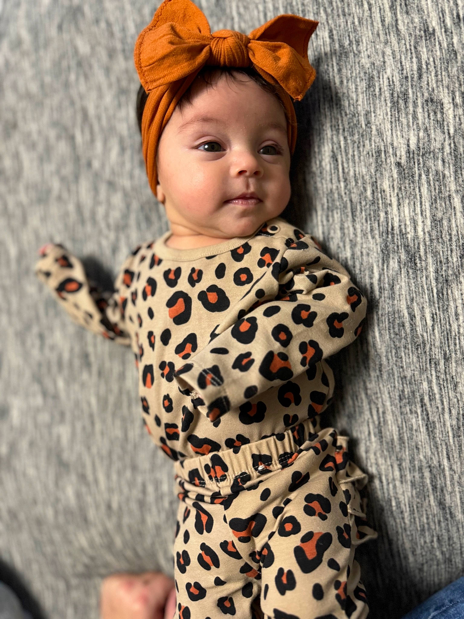 Khloee joined the competition — help win amazing prizes! baby, baby_toddler_clothing, cheek, child, eye, face, fashion_accessory, flooring, fur, happy, head, headgear, headwear, human_body, pattern, person, sitting, sleeve, t_shirt, textile