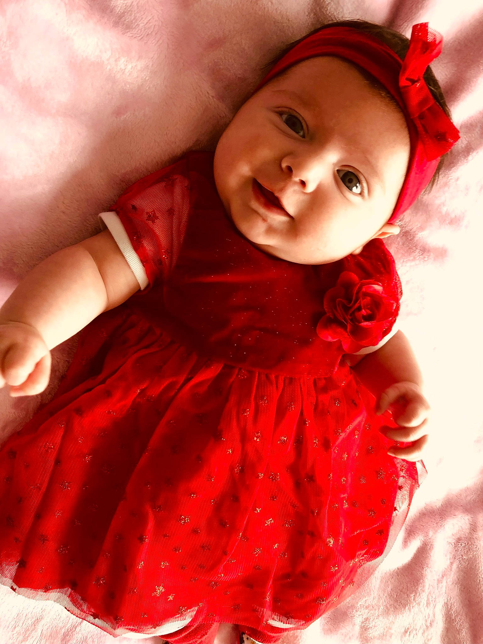 Lindsay participe au concours pour gagner de l'argent avec cette photo : baby_toddler_clothing, day_dress, dress, embellishment, eye, flash_photography, gesture, happy, head, headwear, iris, lip, magenta, outerwear, person, pink, red, skin, sleeve, smile