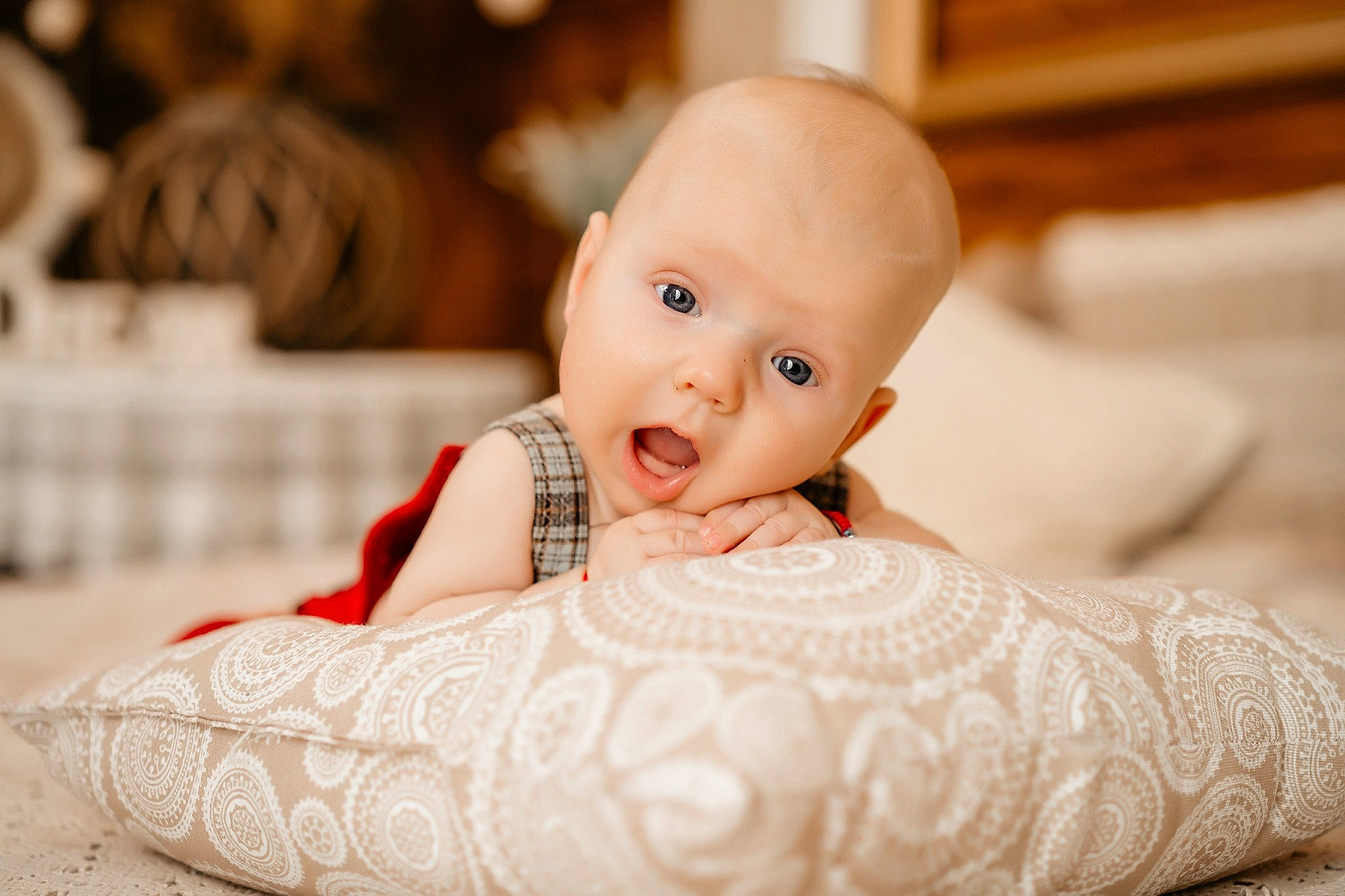 Aryan joined the competition — help win amazing prizes! baby, cheek, child, dress, event, fashion_accessory, flash_photography, flooring, happy, headpiece, iris, linens, peach, person, portrait_photography, room, sitting, skin, surprise, sweetness
