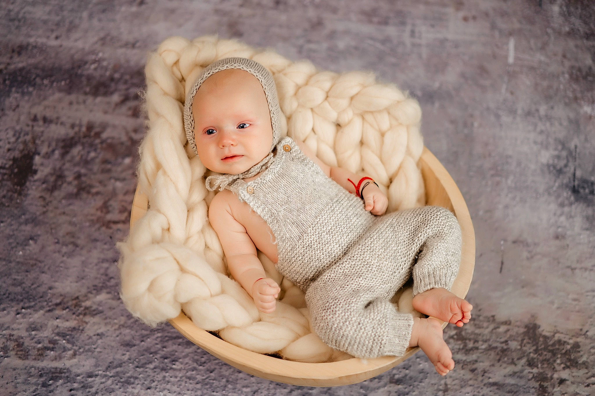 Aryan is registered to the contest to win money with this photo: art, baby, baby_toddler_clothing, cheek, chin, comfort, doll, eye, face, foot, gesture, head, headgear, human_body, iris, jewellery, lip, person, toddler, wood