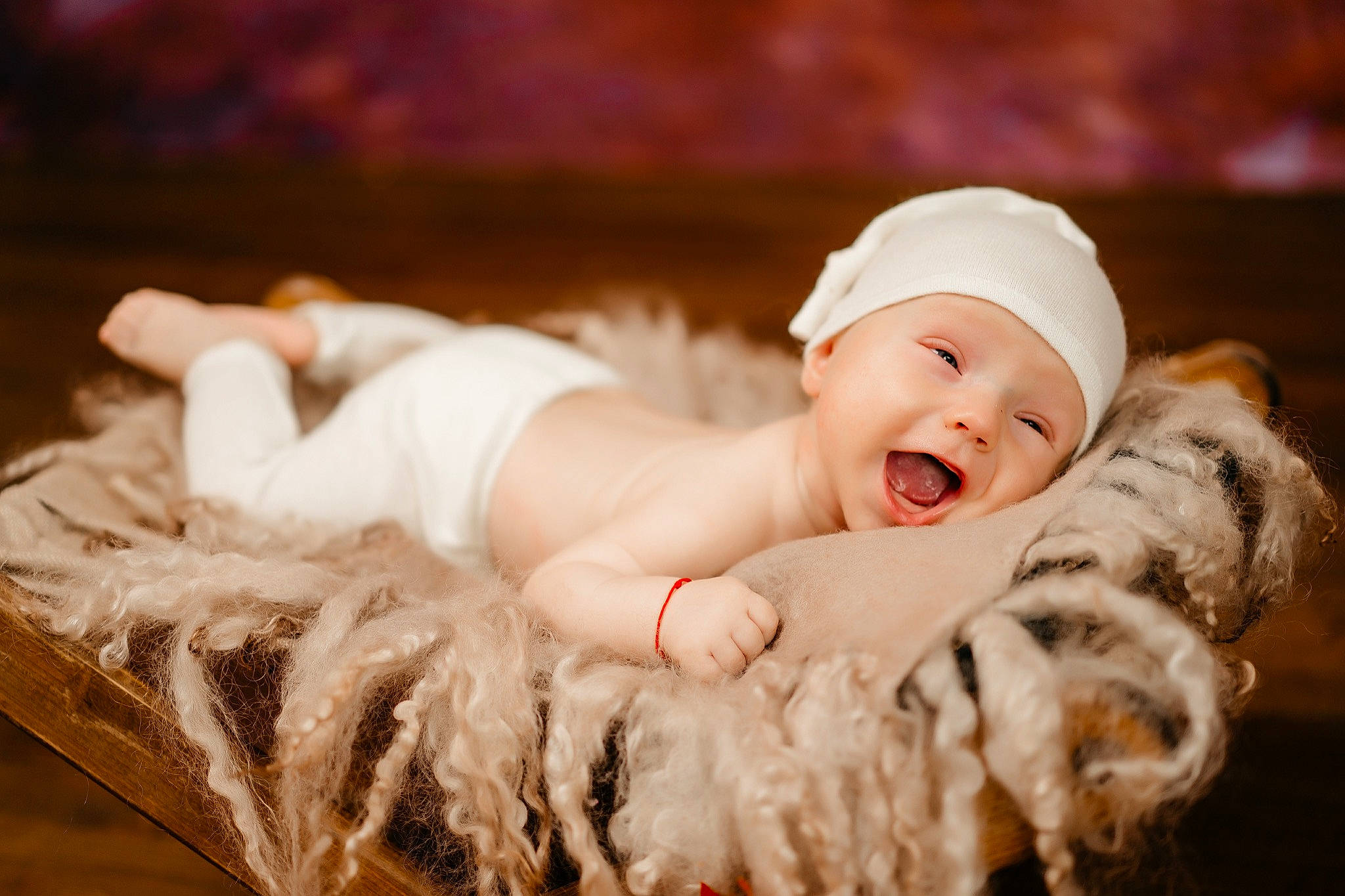 Aryan is registered to the contest to win money with this photo: baby, baby_toddler_clothing, child, comfort, face, flash_photography, fun, fur, grass, happy, hat, headgear, headpiece, headwear, laugh, person, portrait, portrait_photography, sitting, skin