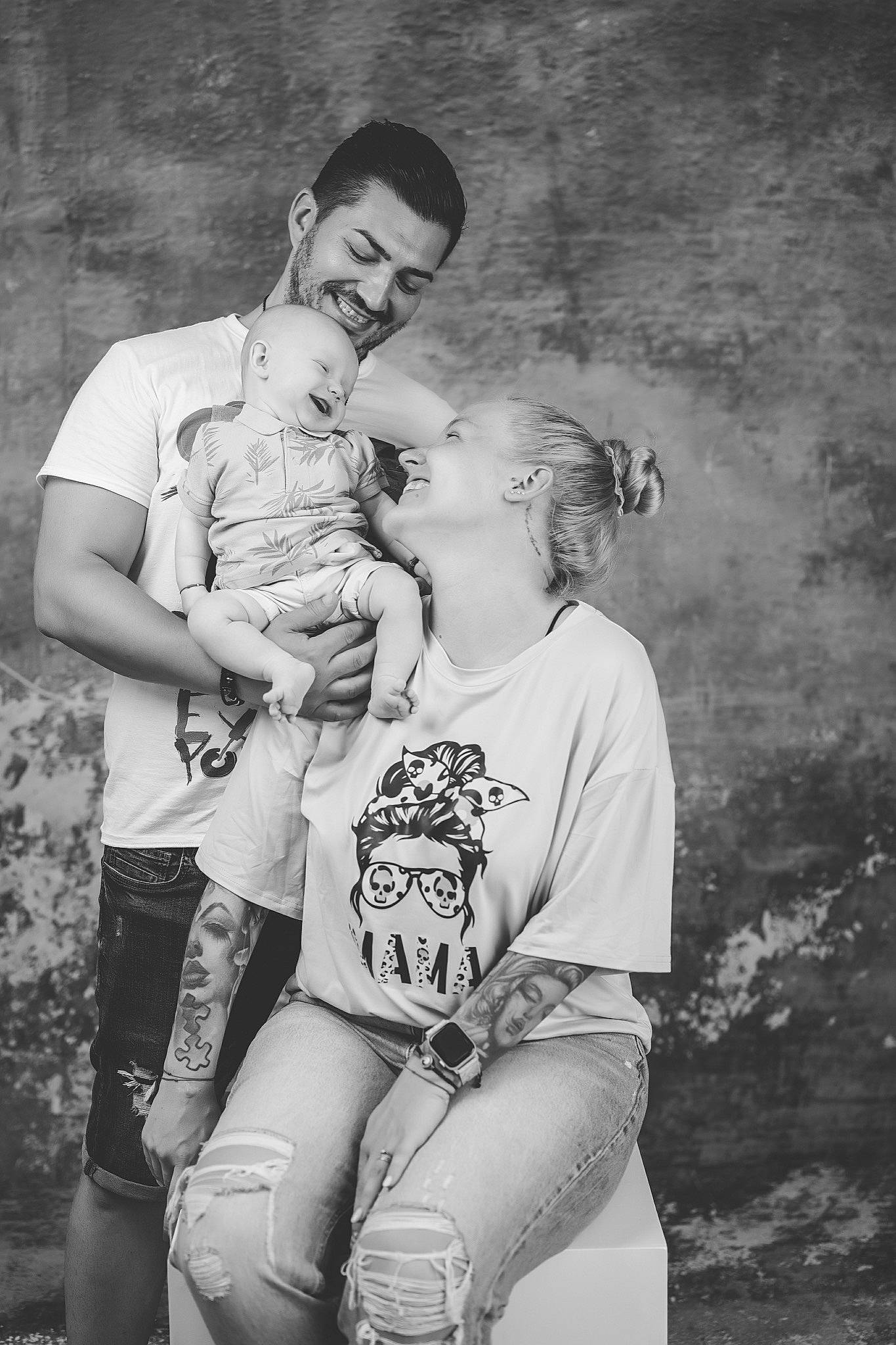 Aryan is registered to the contest to win money with this photo: arm, baby, black_and_white, child, face, flash_photography, fun, gesture, grass, happy, interaction, joy, monochrome, monochrome_photography, person, shorts, smile, standing, style, t_shirt