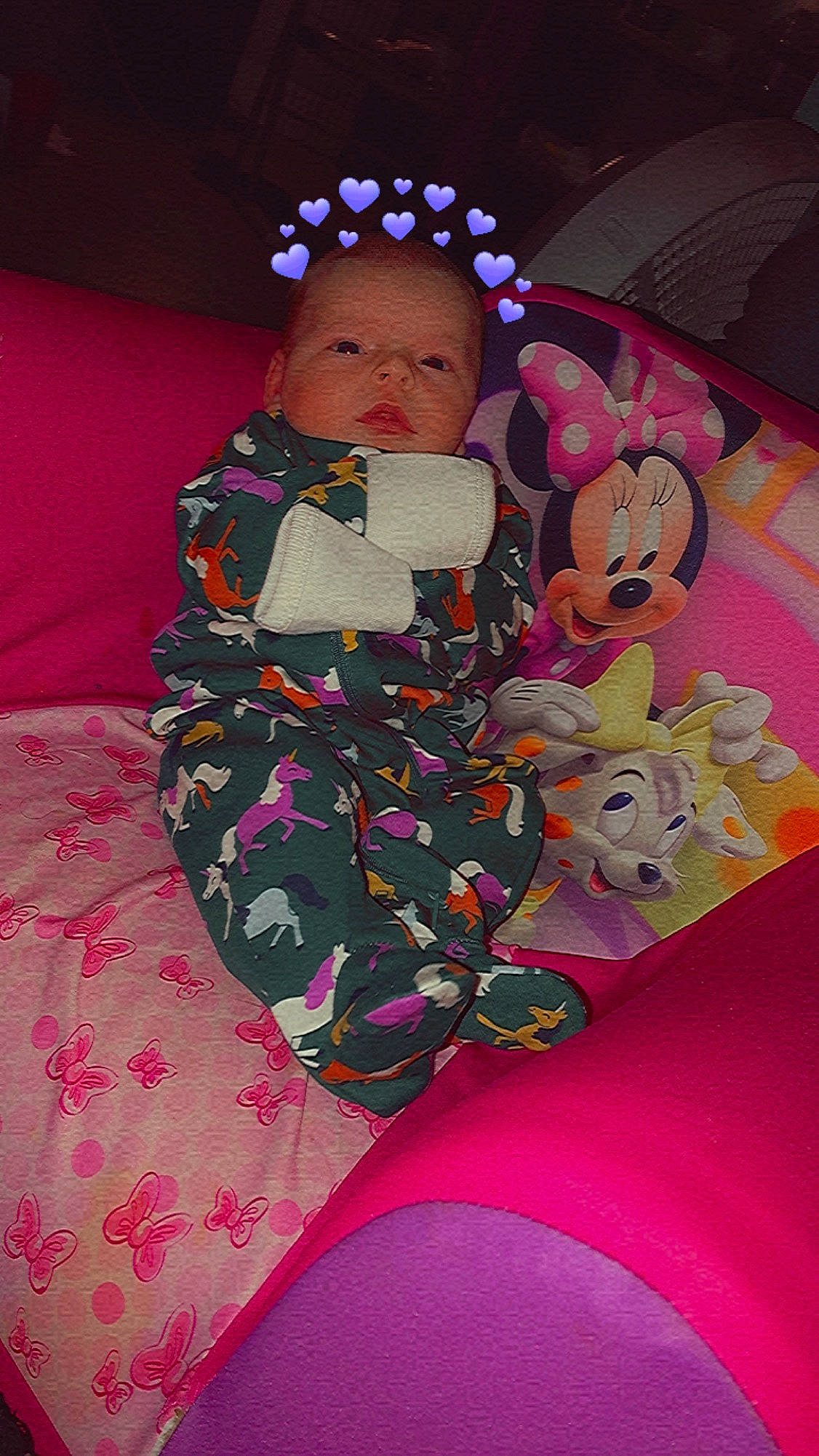 Novalei is registered to the contest to win money with this photo: baby, baby_products, baby_toddler_clothing, carmine, cheek, child, comfort, event, eye, fun, human_body, lap, magenta, pattern, person, pink, purple, sitting, textile, thigh