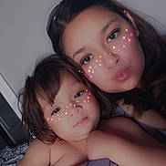 Athena is registered to the contest to win money with this photo: child, toddler, woman, face, portrait, indoor, hug, sparkle_filter, cute, family, love, closeup, skin, expression, casual, head, person, affection, young, together