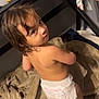 Athena joined the competition — help win amazing prizes! toddler, child, diaper, wet_hair, blanket, bed_frame, floor, curious, looking_back, indoors, person, bareback, home, brown_hair, fabric, furniture, carpet, soft_texture, standing, young
