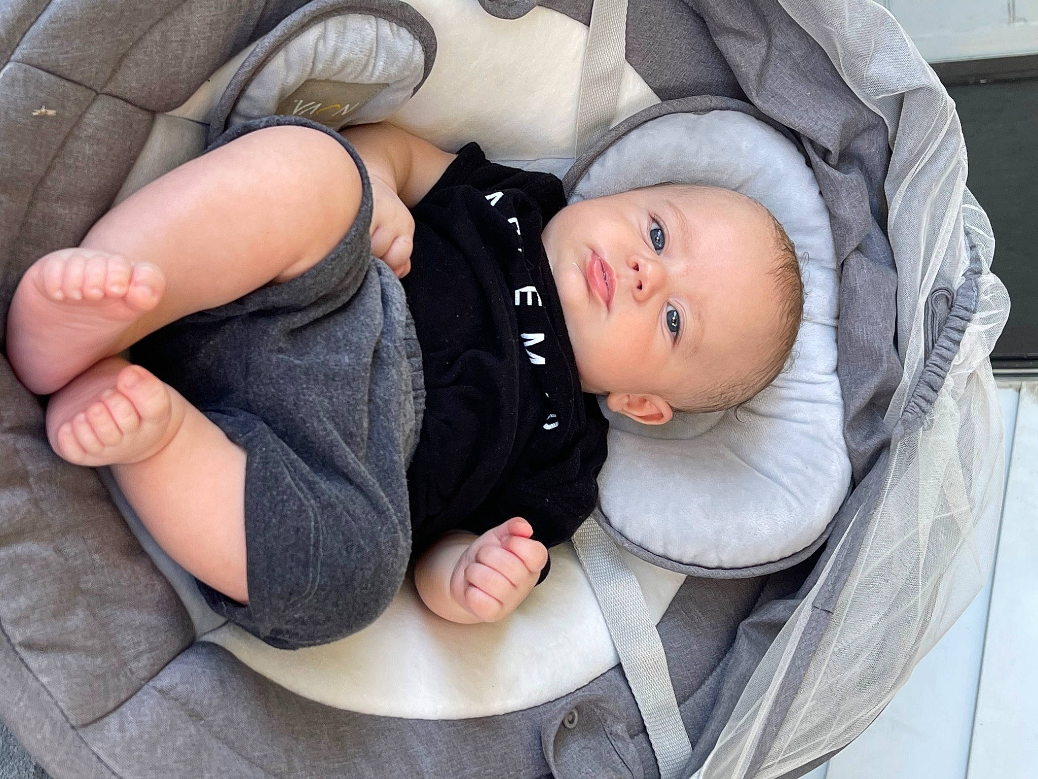 Cody joined the competition — help win amazing prizes! baby, baby_carriage, baby_products, baby_toddler_clothing, child, comfort, fashion_accessory, foot, hat, human_body, leg, linens, nail, person, sitting, skin, sleeve, toddler, tree, wood