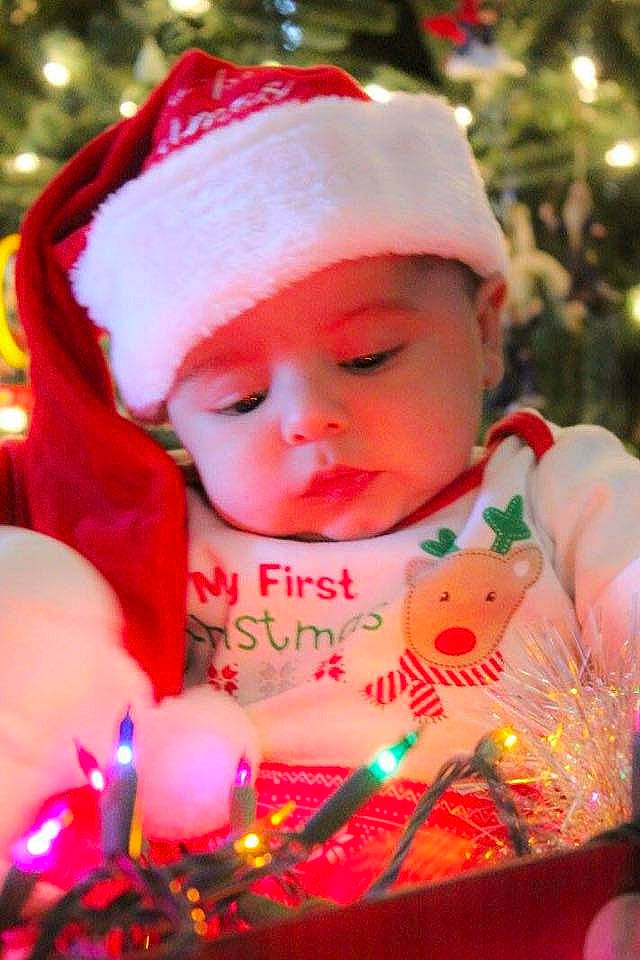 Arrow is registered to the contest to win money with this photo: child, christmas, christmas_decoration, christmas_ornament, holiday, infant, person, pink, toddler