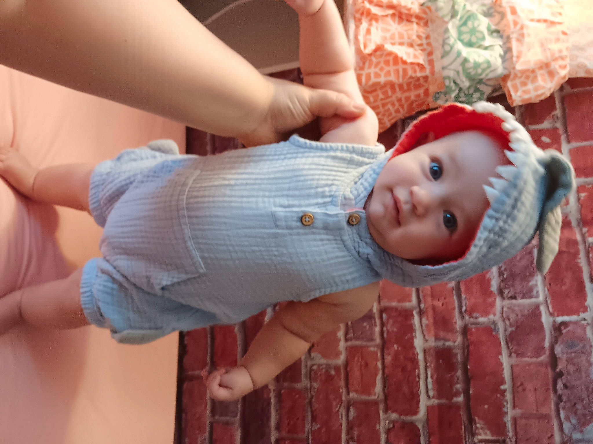 Luna is registered to the contest to win money with this photo: abdomen, baby, baby_toddler_clothing, elbow, finger, gesture, happy, hat, headwear, human_body, human_leg, lip, mouth, person, pink, skin, smile, thigh, toddler, tree