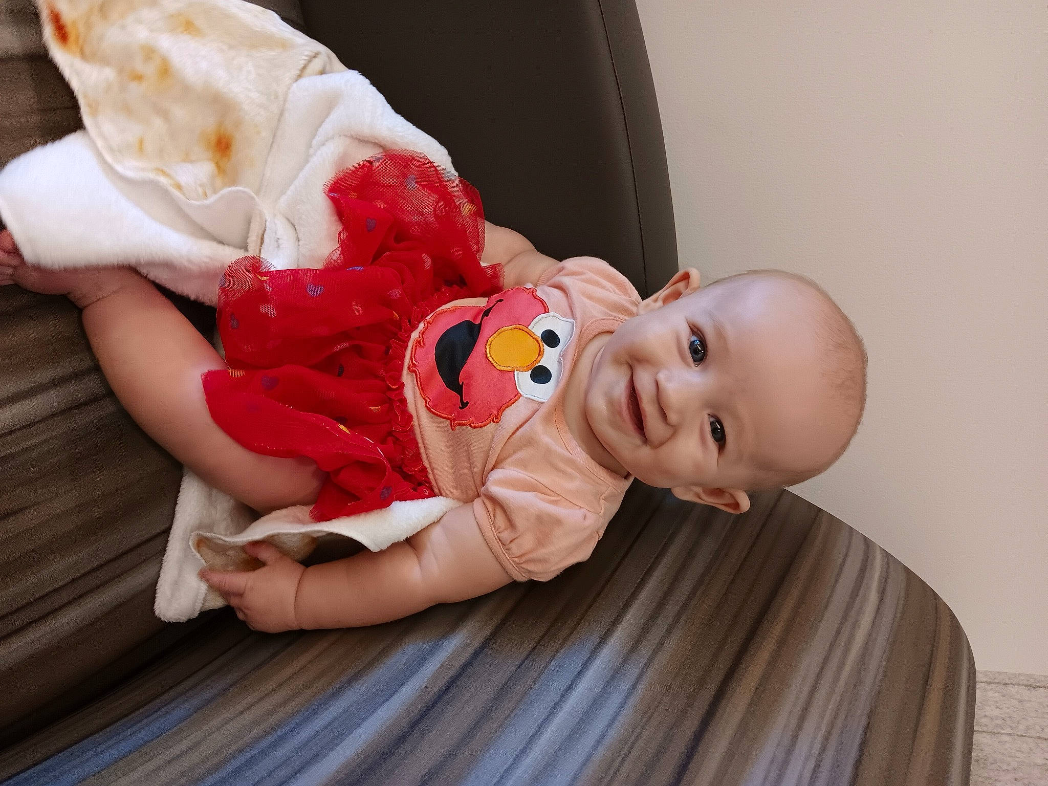 Luna joined the competition — help win amazing prizes! baby, baby_products, baby_toddler_clothing, carmine, child, comfort, dress, event, flooring, fun, happy, hardwood, hat, human_body, joy, person, room, sitting, skin, smile