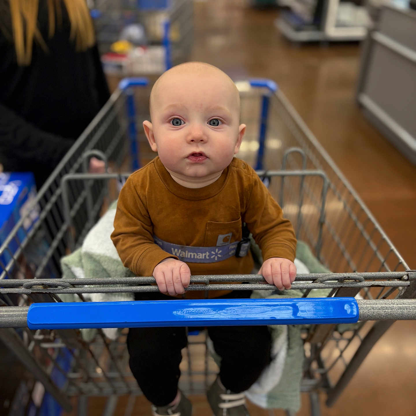 Bently joined the competition — help win amazing prizes! adult, baby, bodypart, clothing, face, female, finger, footwear, hand, head, indoors, pants, person, shelf, shoe, shop, shopping, shoppingcart, woman, wood