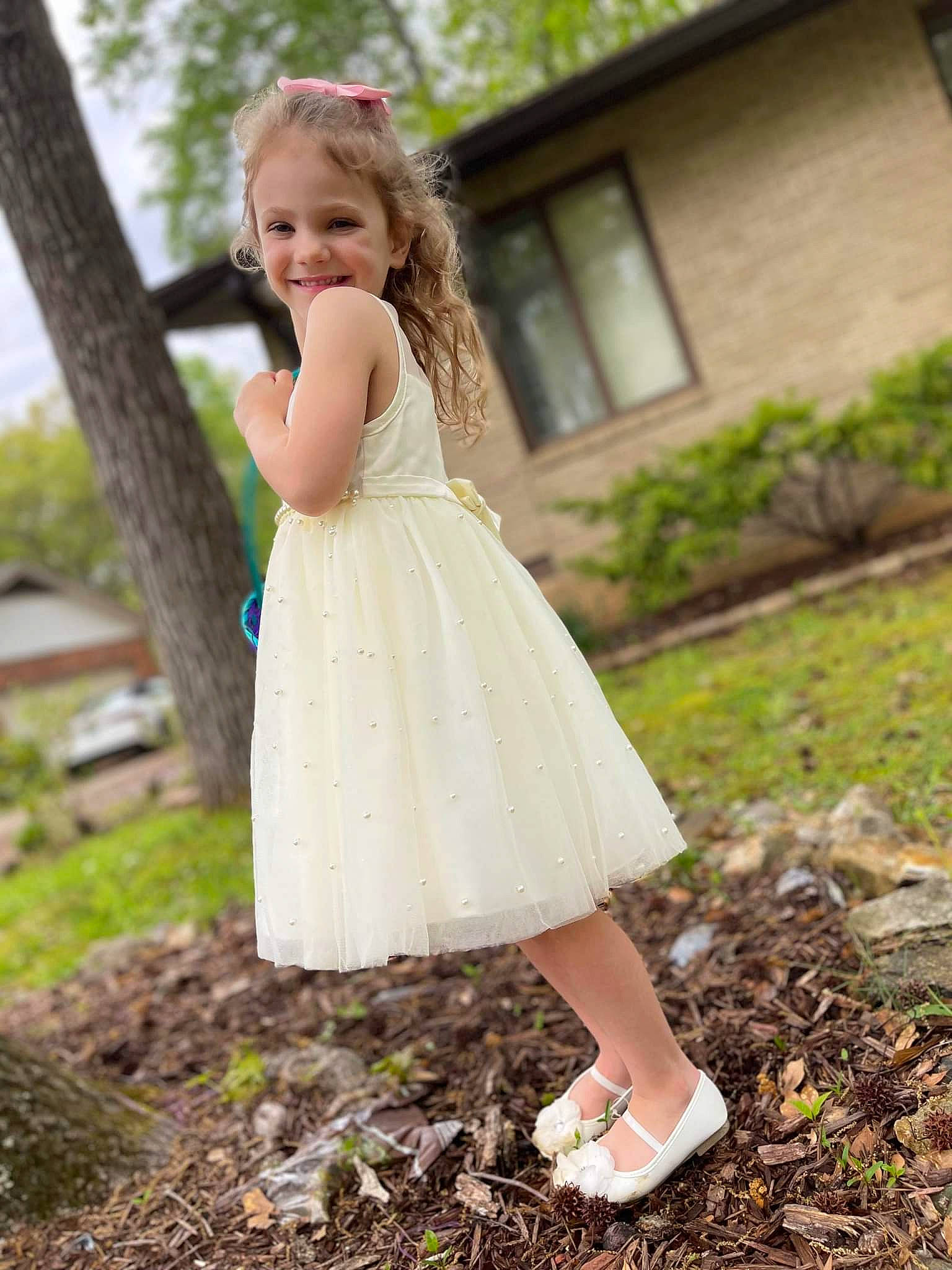 Madelynn is registered to the contest to win money with this photo: blond, bridal_party_dress, day_dress, dress, flash_photography, formal_wear, grass, happy, human_leg, joy, leaf, leg, long_hair, people_in_nature, person, plant, shoulder, toddler, tree, waist