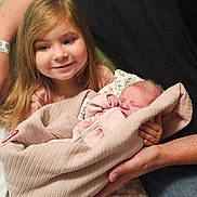 Grace joined the competition — help win amazing prizes! adult, baby, blanket, child, clothing, cozy, cute, family, happy, holding, human, indoor, love, newborn, parent, people, portrait, seated, smiling, toddler