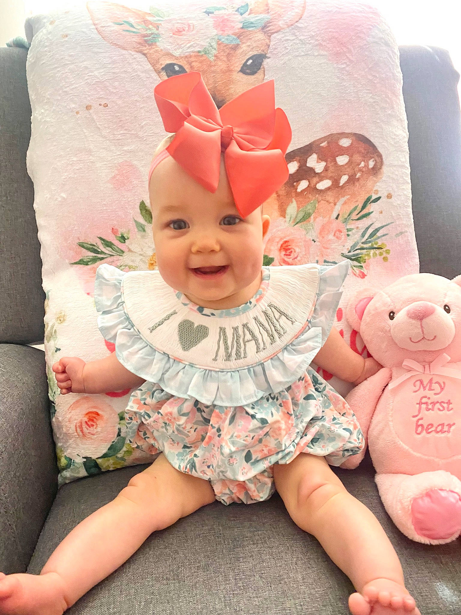 Sloane Elise is registered to the contest to win money with this photo: art, baby, baby_toddler_clothing, child, comfort, face, fun, happy, hat, headwear, human_body, joy, magenta, pattern, person, pink, product, sitting, skin, smile