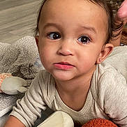 Christopher joined the competition — help win amazing prizes! toddler, child, baby, face, eyes, earring, blanket, toy, bottle, curious, indoor, floor, clothing, expression, portrait, skin, hair, mouth, hand, cuteness