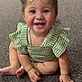 baby, child, smiling, pigtails, blue_flower_clips, green_outfit, checkered, carpet, cute, happy, sitting, hands, feet, indoors, portrait, infant, adorable, face, eyes, tooth