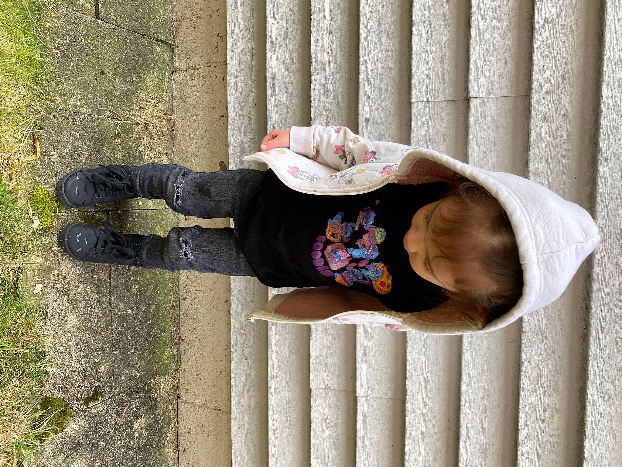 Emily joined the competition — help win amazing prizes! baby_toddler_clothing, bangs, child, collar, dress, elbow, fashion_accessory, hat, human_body, human_leg, knee, leg, pattern, person, rectangle, sitting, sleeve, thigh, waist, wood