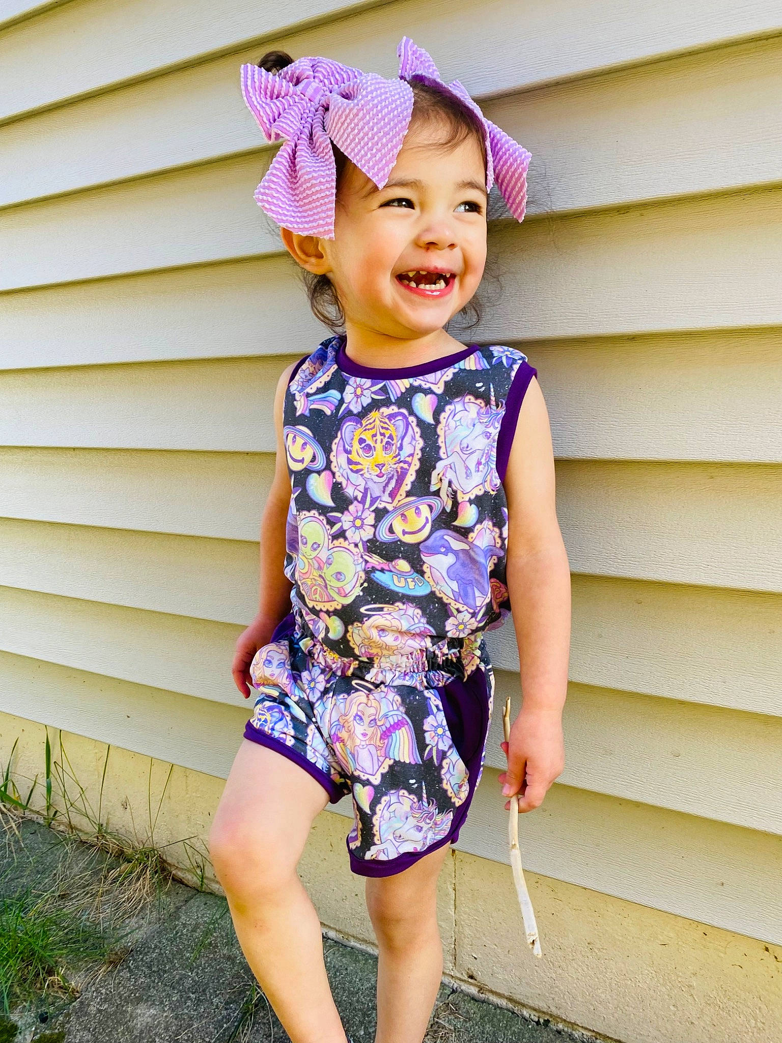 Emily joined the competition — help win amazing prizes! baby_toddler_clothing, dress, electric_blue, eye, face, fun, happy, head, human_leg, joy, magenta, one_piece_garment, pattern, person, pink, purple, sleeve, smile, t_shirt, toddler