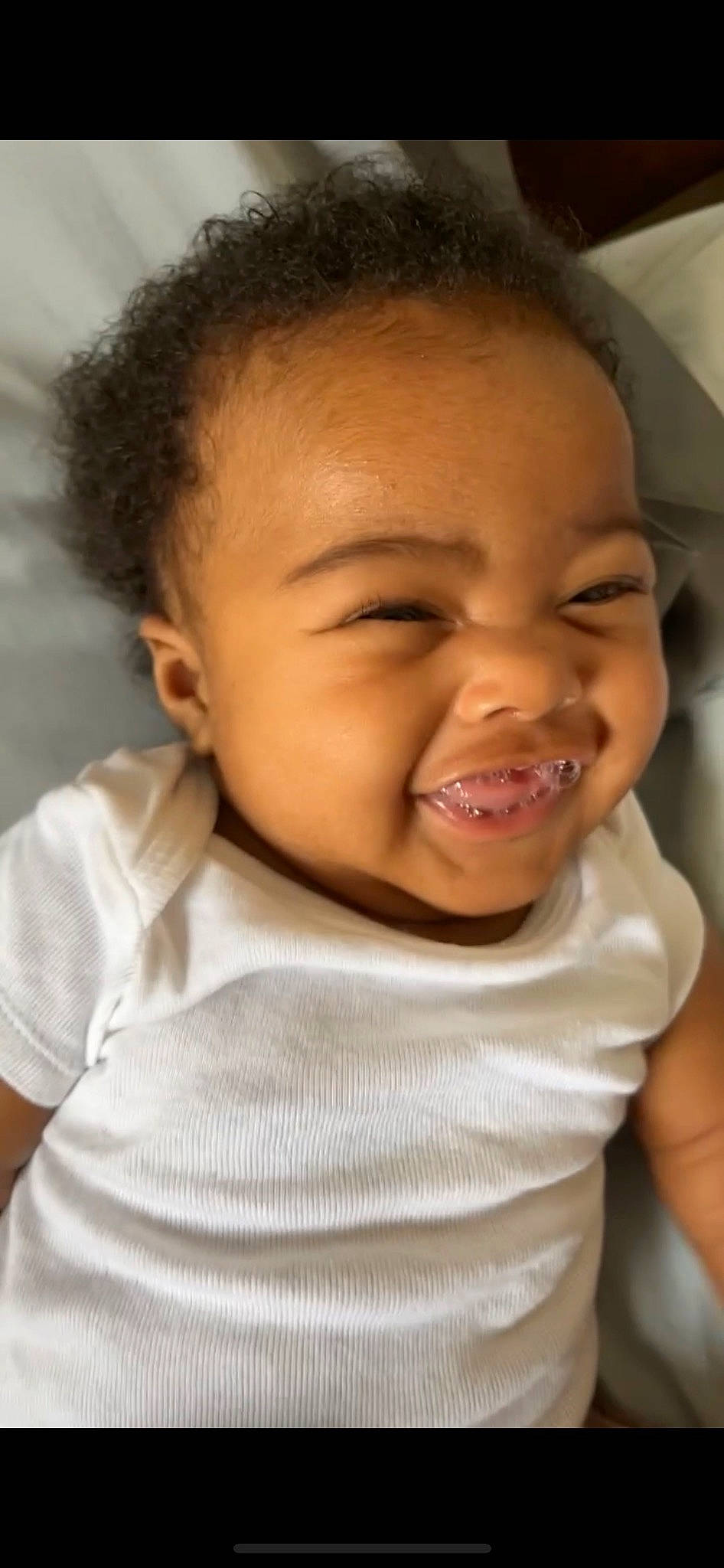 Brooklyn is registered to the contest to win money with this photo: baby, cheek, chin, ear, eye, eyebrow, gesture, hairstyle, happy, iris, jaw, lip, mouth, neck, nose, person, skin, sleeve, smile, standing