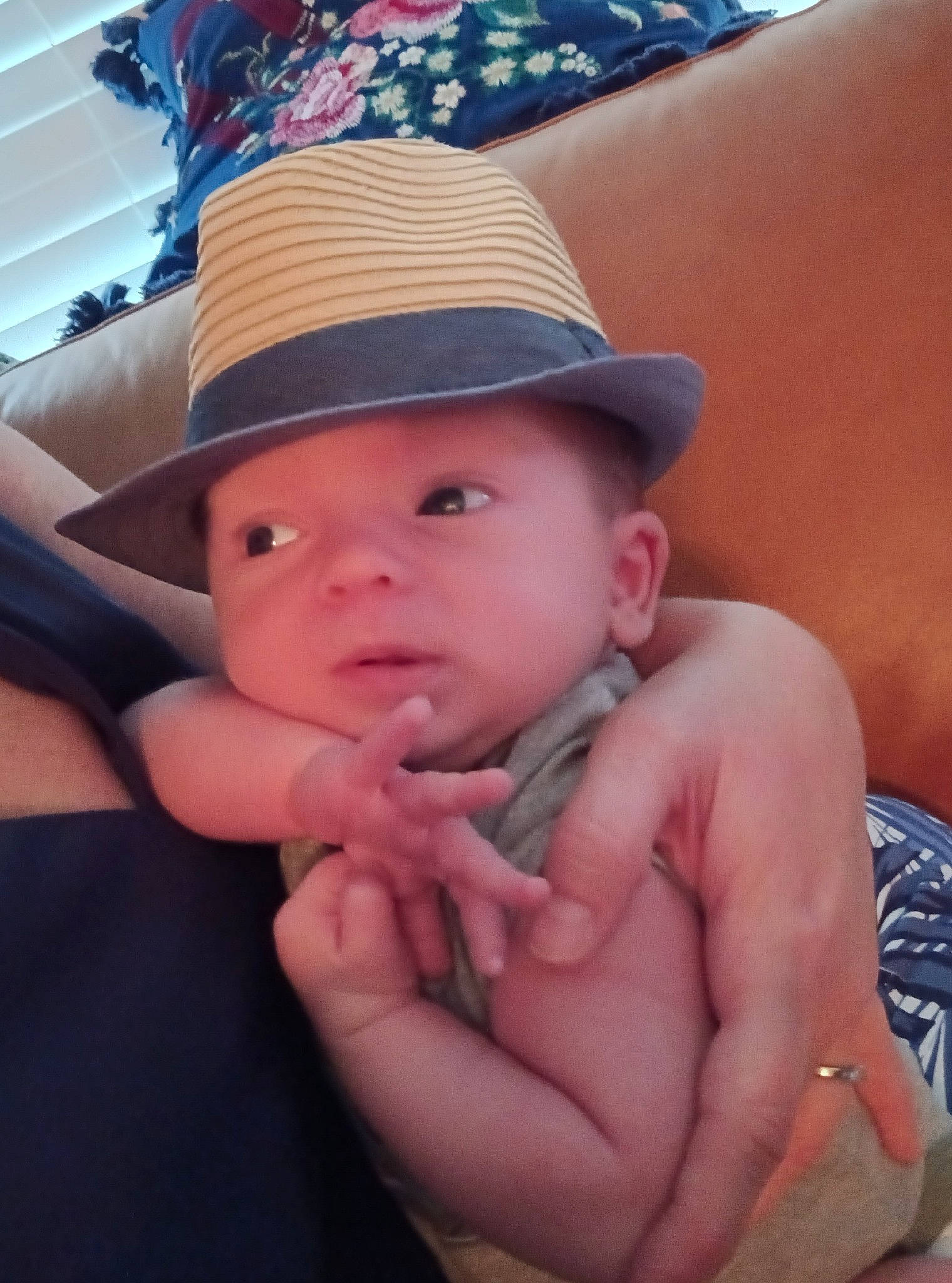 Luca is registered to the contest to win money with this photo: baby, comfort, elbow, eye, face, finger, fun, gesture, hand, happy, hat, head, headwear, joint, lip, mouth, neck, person, skin, sun_hat