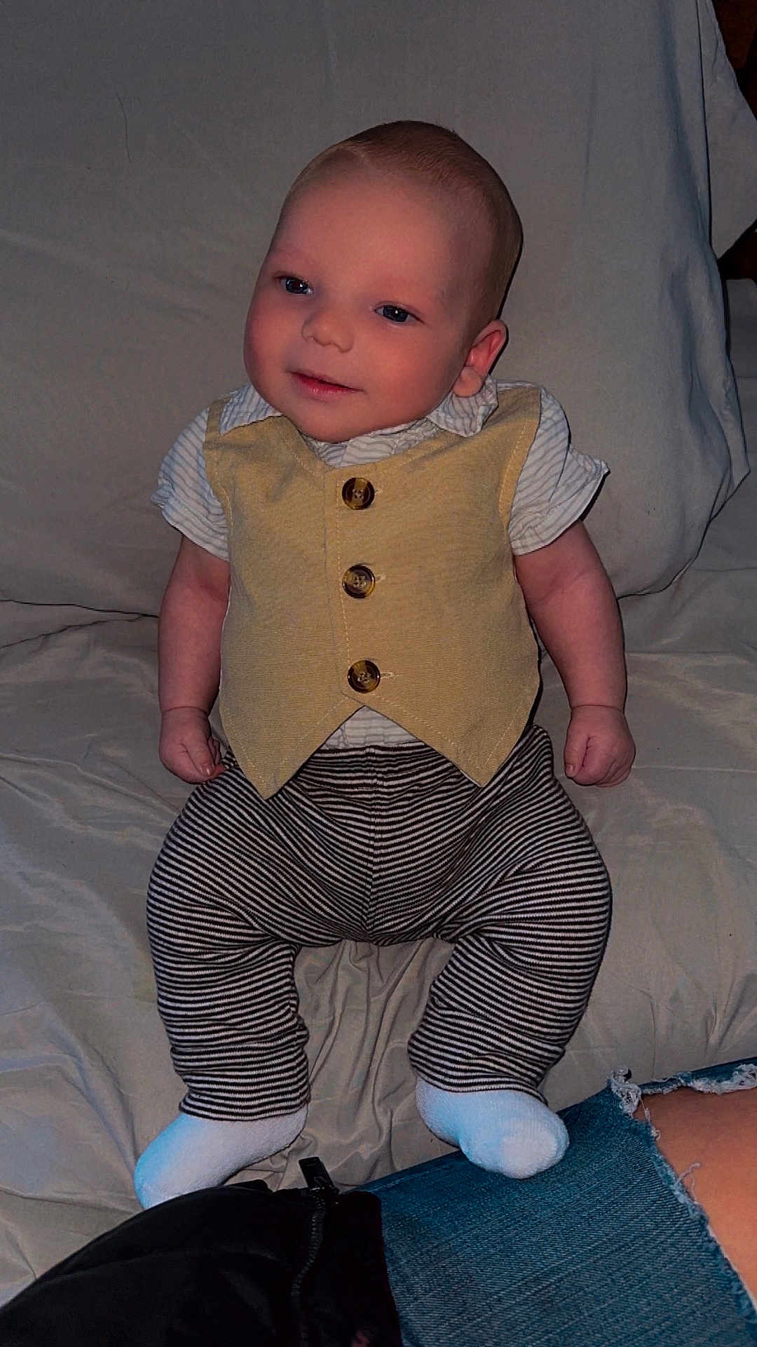 Hayden joined the competition — help win amazing prizes! baby, child, infant, vest, striped_pants, socks, smile, face, person, sitting, indoor, fabric, clothing, cute, happy, young, portrait, casual, comfort, soft