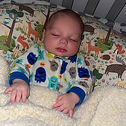 Hayden is registered to the contest to win money with this photo: baby, sleeping, blanket, onesie, crib, animal_pattern, hand, face, infant, bed, pajamas, cozy, child, cute, soft, peaceful, sleep, indoor, toddler, nursery