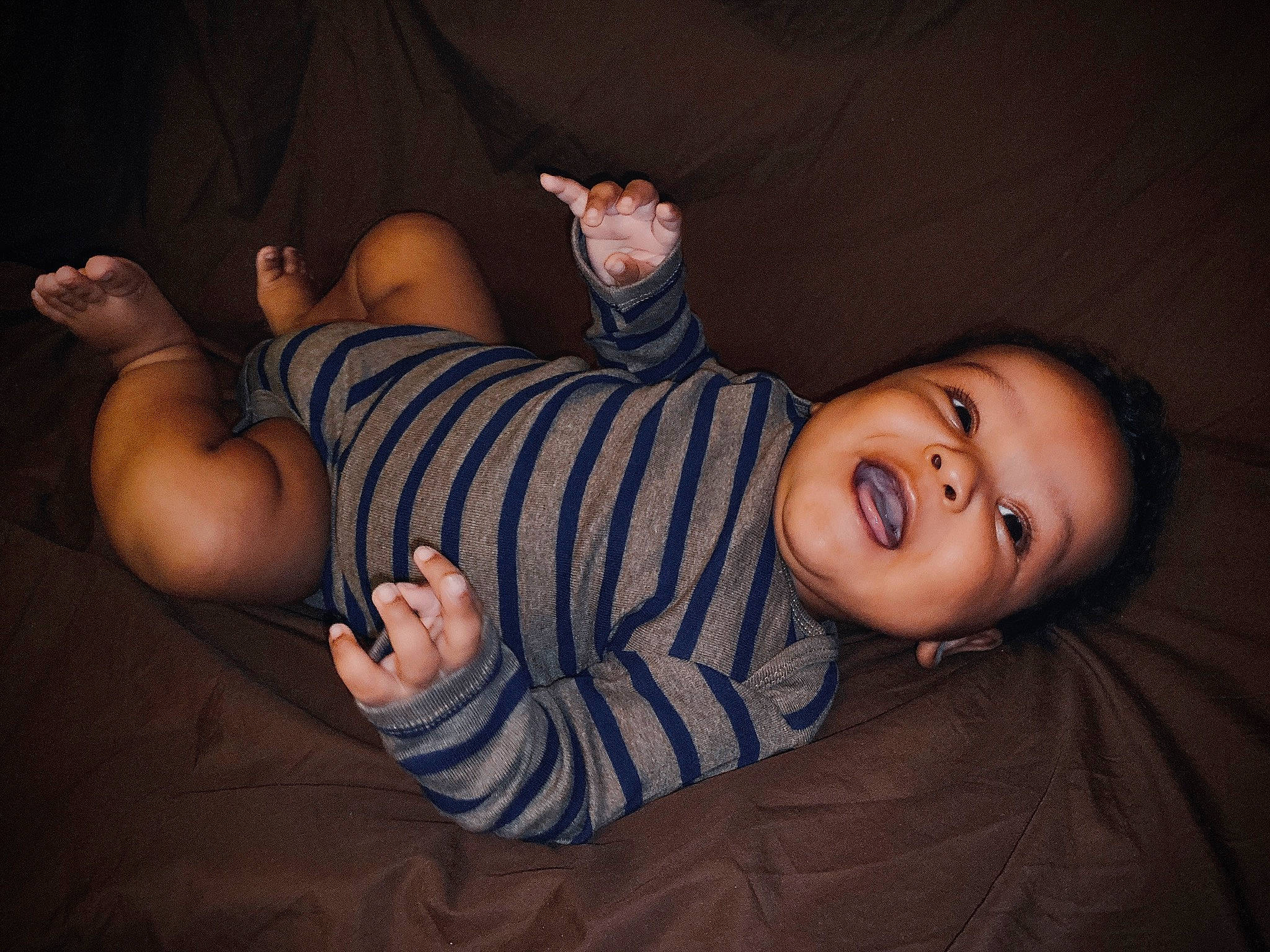 Jessiah is registered to the contest to win money with this photo: arm, baby, cheek, child, ear, elbow, finger, foot, fun, gesture, hand, human_body, joint, leg, muscle, nose, person, photography, smile, thumb