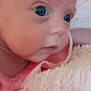 Serenity joined the competition — help win amazing prizes! baby, infant, close_up, face, hand, blanket, soft_texture, cute, skin, eyes, pink_clothing, newborn, portrait, indoor, child, expression, curious, young, human, resting