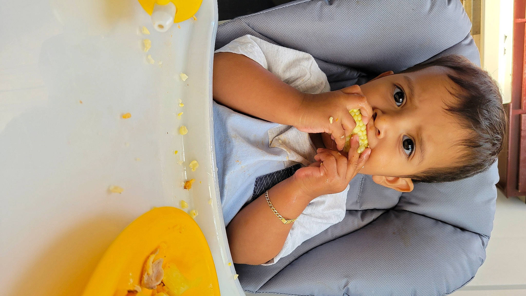 Jose joined the competition — help win amazing prizes! baby, baby_food, baby_products, baby_toddler_clothing, chair, cheek, child, eyelash, fun, happy, leisure, mouth, nail, orange, person, room, sitting, tableware, toddler, white